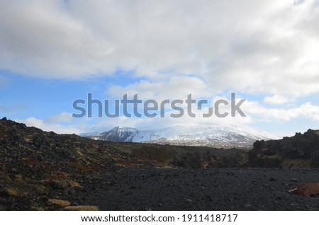 Image, Stock Photo Snow-covered mountain and Icelandic moss