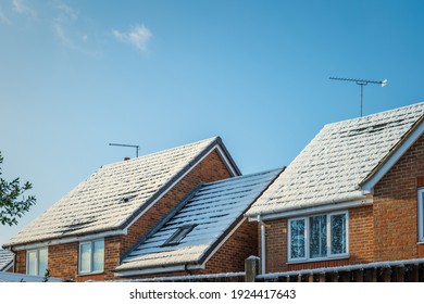 Snow Covered New Built House Roof In England Uk.