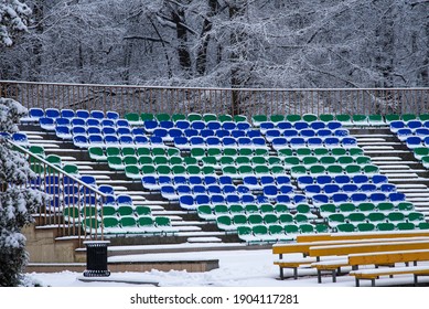 Snow Covered Outdoor Concert Venue With Empty Seats Covered With Snow