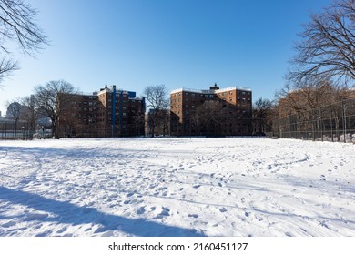 Snow Covered Park Next To Public Housing In Astoria Queens New York During The Winter