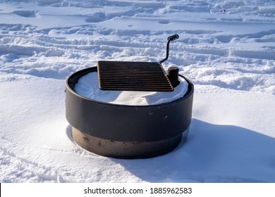 Snow Covered Picnic Grill Firepit Ring, In Winter