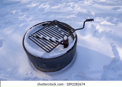 Snow Covered Picnic Grill Firepit Ring, In Winter