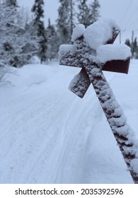 Snow Covered Sign In The Forest