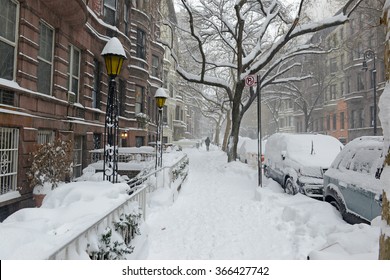 Snow Covered Street And Brownstone Buildings During Snowstorm In Manhattan, New York City