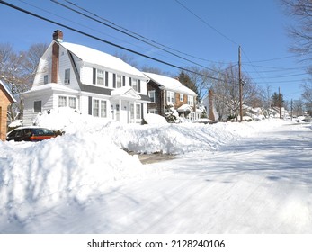 Snow covered suburban Long Island New York neighborhood street after northeastern winter snowstorm - Powered by Shutterstock