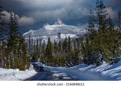 Snow Covered Three Fingered Jack Mountain And Cars On Access Road To Hoodoo Ski Area In The Central Oregon Cascade Mountains