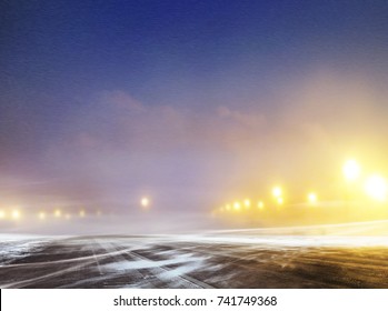 Snow Covered Winter Road To Airport At Night