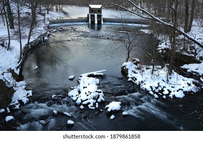 Snow Covers The Mouth Of Historic Speedwell Dam In Morristown, New Jersey. 