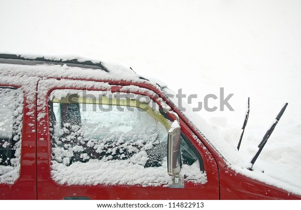 snow covers on\
car\'s window as snowing\
weather