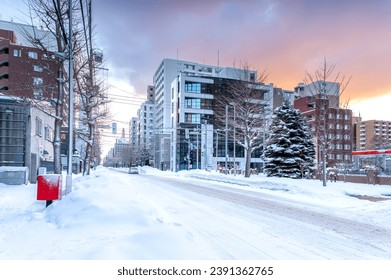 Snow covers roads and Beautiful sky in the morning in Sapporo, Hokkaido, Japan. - Powered by Shutterstock