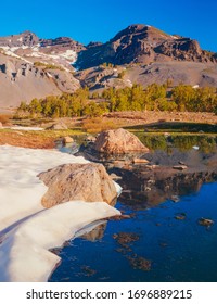 Snow Creates Crescent Shape As It Melts Around Koenig Lake In The Sonora Pass Of The Californian Sierra Nevada Range.