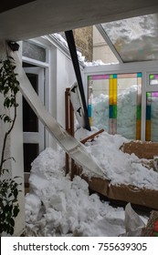 Snow Damage Inside A Home After Thick Icy Snow Slid Of A Roof And Crashed Through A Conservatory. 