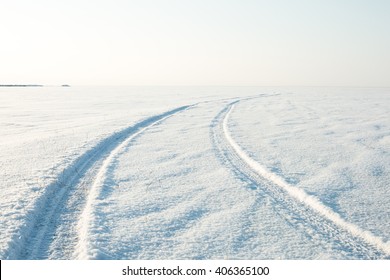 snow desert and the tracks of the car in the snow