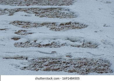 snow drift patterns on winter grass stuble