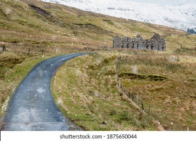 Snow Falling On Old School House And Small Road, Mountains Covered With Snow In The Background.Scene At The Gleniff Horseshoe Loop Drive In County Sligo, Ireland, Travel And Tourism Concept