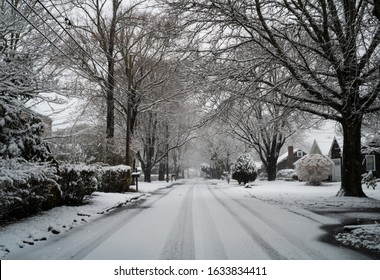Snow Falls Over A New England Neighborhood In Winter