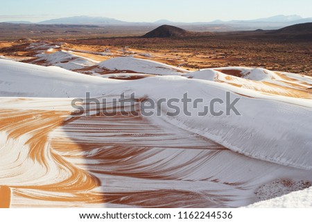 
Snow falls in the Sahara