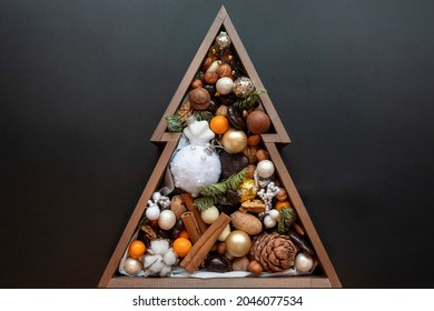 Snow fir tree, photo frames and christmas decor on rope over rustic wooden board - Powered by Shutterstock