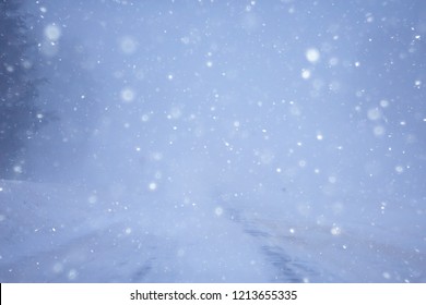 snow and fog on the winter road landscape / view of the seasonal weather a dangerous road, a winter lonely landscape - Shutterstock ID 1213655335