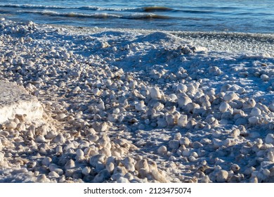 Snow, Frost, And Wind Create Irregularly Shaped Ice Balls On The Shores Of Lake Michigan