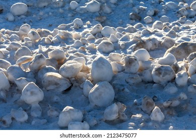 Snow, Frost, And Wind Create Irregularly Shaped Ice Balls On The Shores Of Lake Michigan