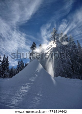 Snow gun, snow making process on a ski slope. Climate control with snowcannon on a ski resort, artificial snow spray on a mountains.Borovets, Bulgaria