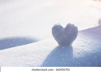 Snow Heart On Snowing Bench. Winter Concept