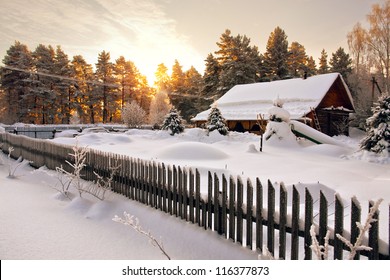 Snow House In Winter Dreamland At Dawn In Forest Old Weather And A Lot Of Snow On Roof