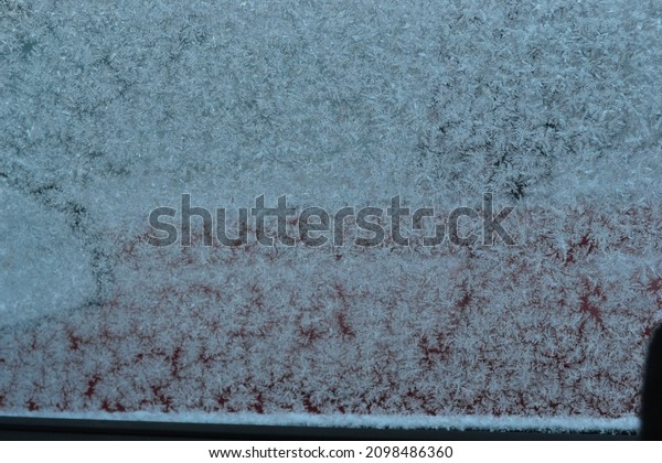 Snow and ice flakes on\
cars