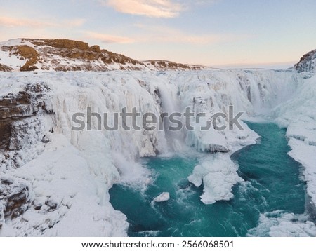Snow and ice run down Gullfoss Falls, Iceland