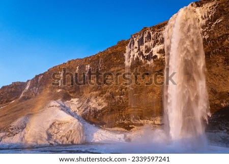 Snow and ice at Seljalandsfoss waterfall in iceland