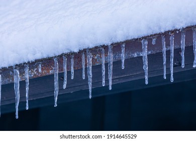 Snow And Icicles On The Eaves