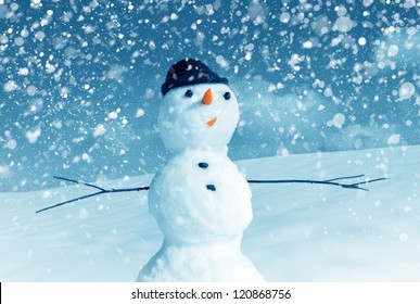 Snow man in santa cap on nature in sunny cold day