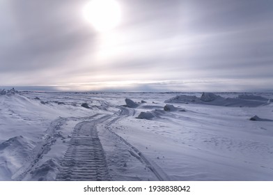 Snow Mobile Tracks Into The Arctic Ocean. Utqiagvik, AK.