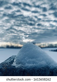 Snow Mound With Clouds In The Background.