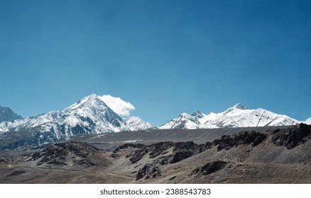 A snow mountain in Northern India with the dark blue sky. This photo was taken by Yashica electro 35.