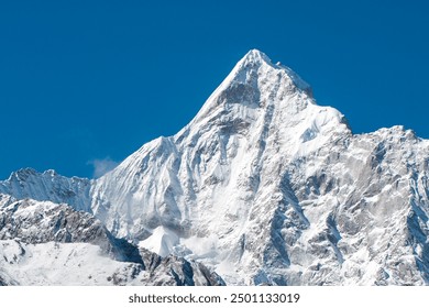 Snow mountain peak towering over a serene, snow mountains landscape, capturing the beauty of winter wilderness. Ideal for nature, adventure, and winter-themed project. - Powered by Shutterstock