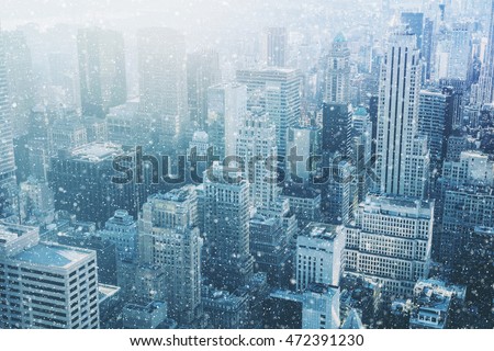 Snow in New York City - fantastic image,  skyline with urban skyscrapers in Manhattan, USA