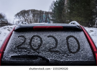 Snow On The Car Where The Numbers Are Written 2020, Close Up Back Window Of The Car. 2020 Happy New Year.