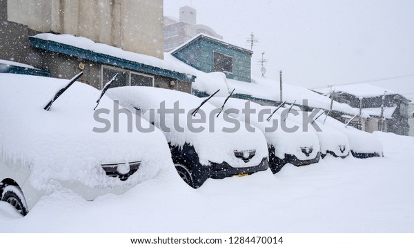 snow on the cars in\
japan winter season