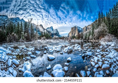 Snow on the rocks of a mountain river. Mountain forest river water in snow. Snowy mountain forest river valley. River stones in snow