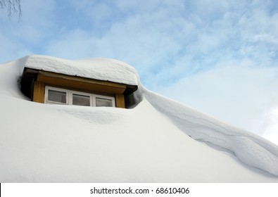 lot of snow on the roof at winter