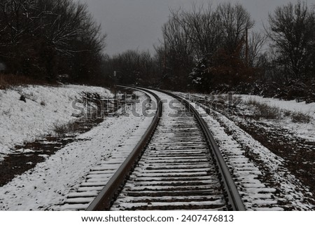 Snow on a set of train tracks
