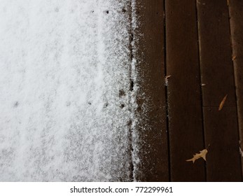 Snow On A Wood Deck