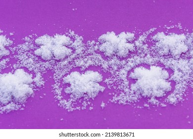 Snow and patterns on a pink background.