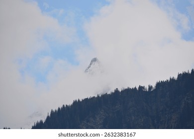 Snow peaks in the clouds
