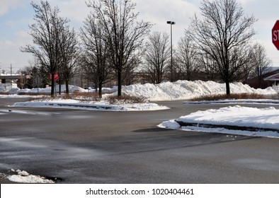 Snow Pile On Parking Lot.