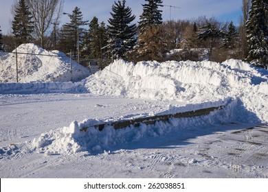 Snow Piled At Private Property Parking Lot