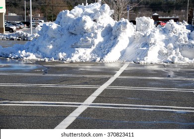 Snow Piles By The Side Of Parking Lot