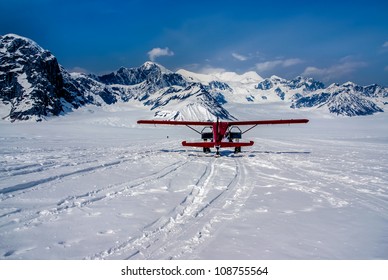 Snow Plane Landing On Ruth Glacier In Denali National Park, Alaska.  The Great Alaskan Wilderness.  A Beautiful Snowscape Of Rock, Snow, And Ice.